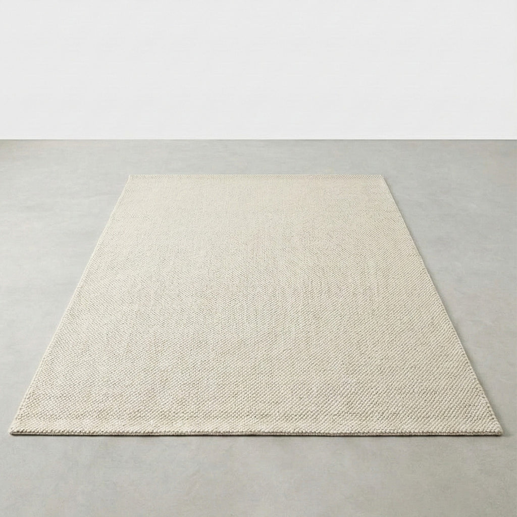 Beige rug on a plain gray background