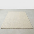 Beige rug on a plain gray background