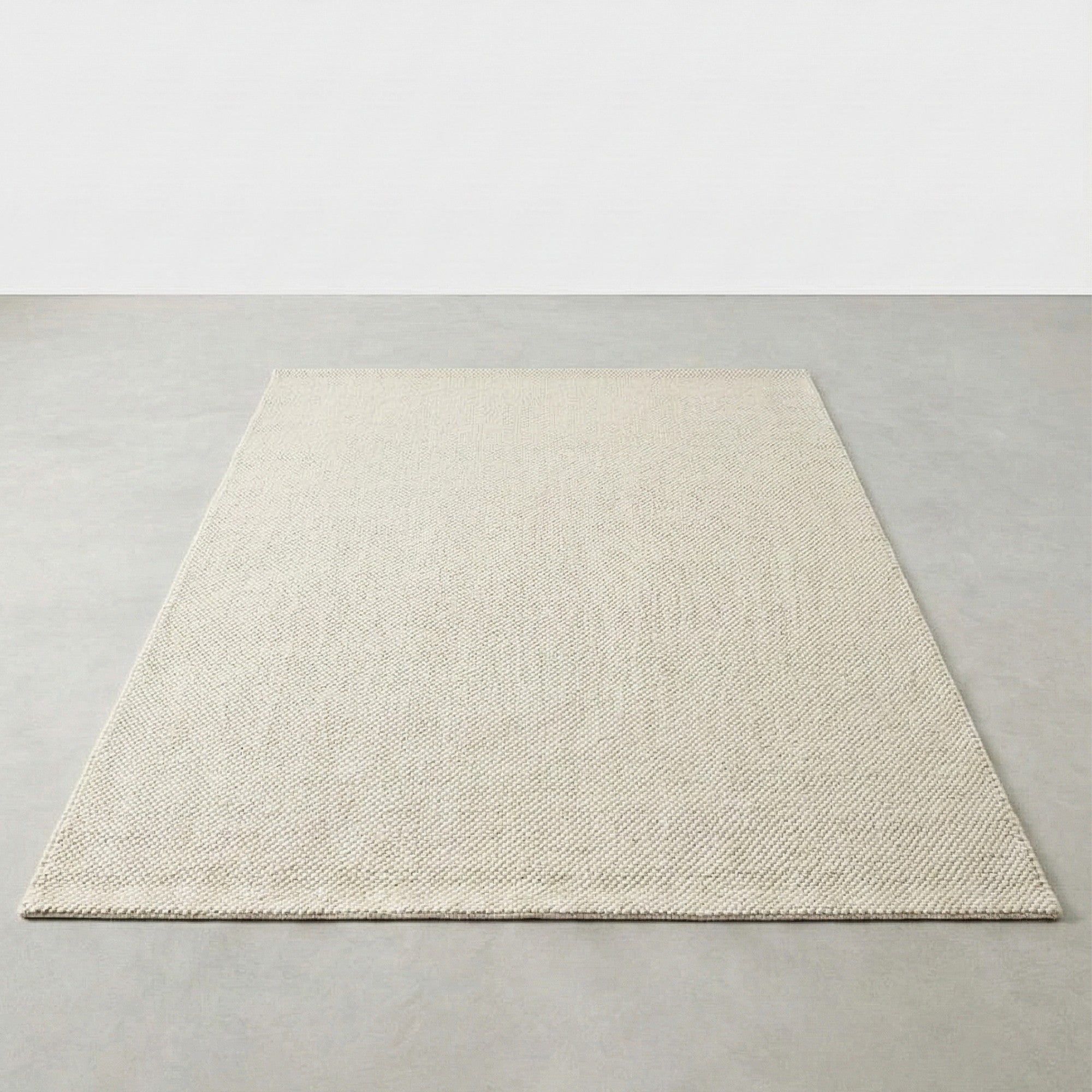 Beige rug on a plain gray background