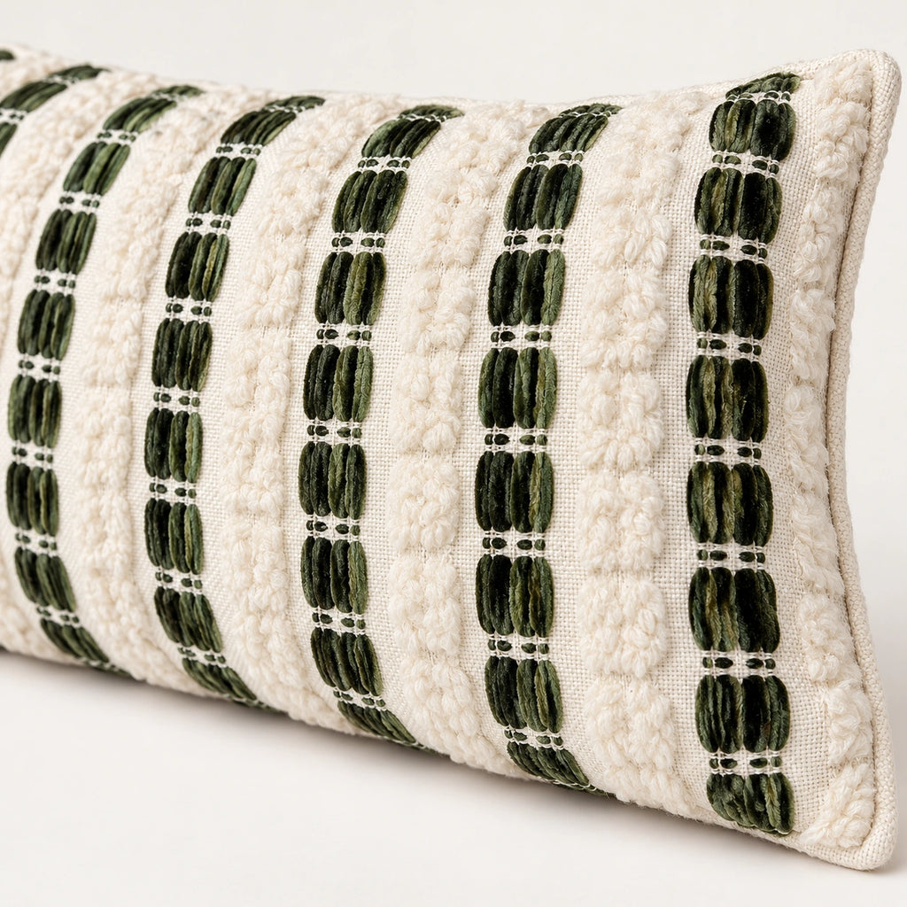 Close-up of ivory tufted texture and olive green woven stripes