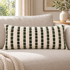 Ivory and olive 30 x 70 cm lumbar cushion styled on a neutral sofa