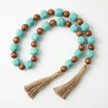 RI25-NG08 Luhpar Wooden Bead Garland with Turquoise Accent & Tassel