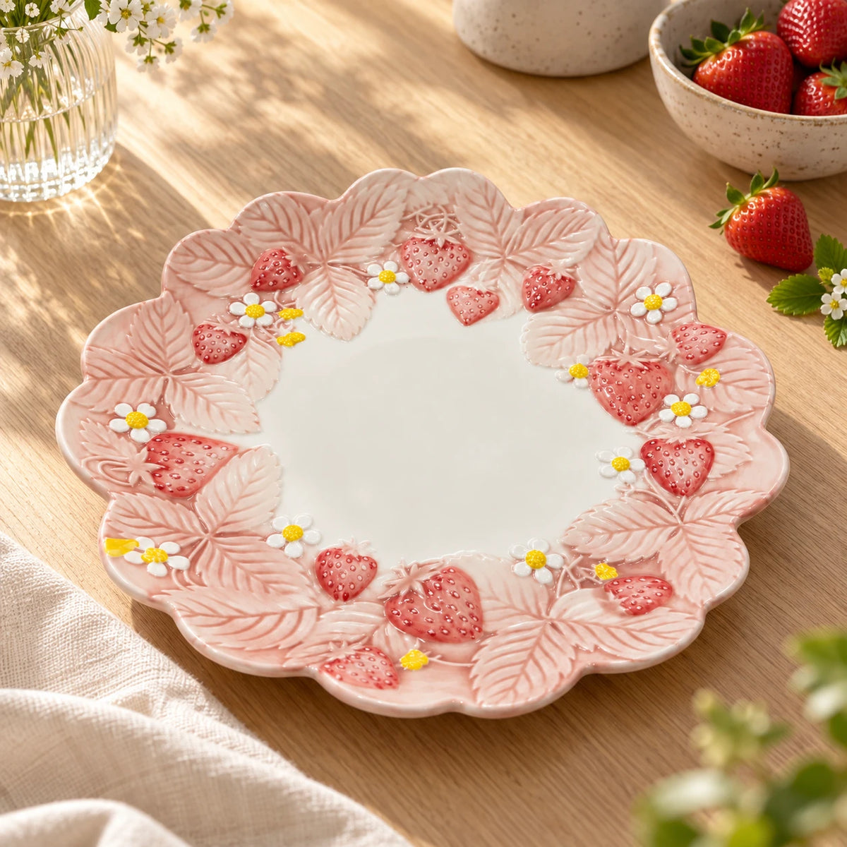 Berry Bloom strawberry and blossom dinner plate styled on a wooden table with fresh strawberries