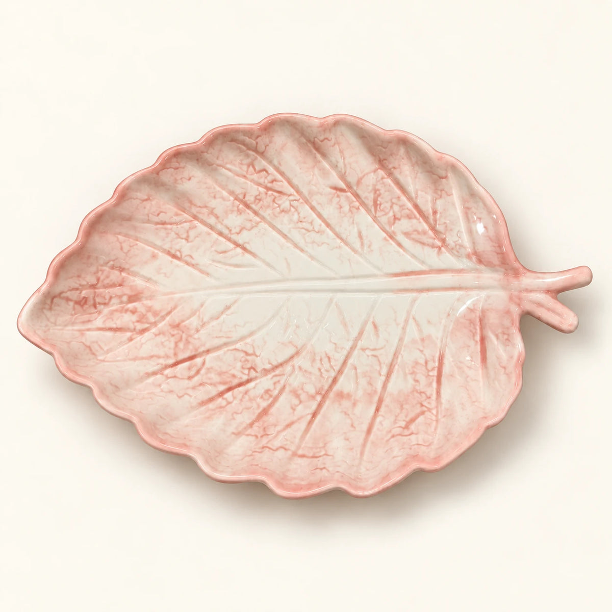 Overhead view of Berry Bloom blush leaf plate with sculpted veins and scalloped edge