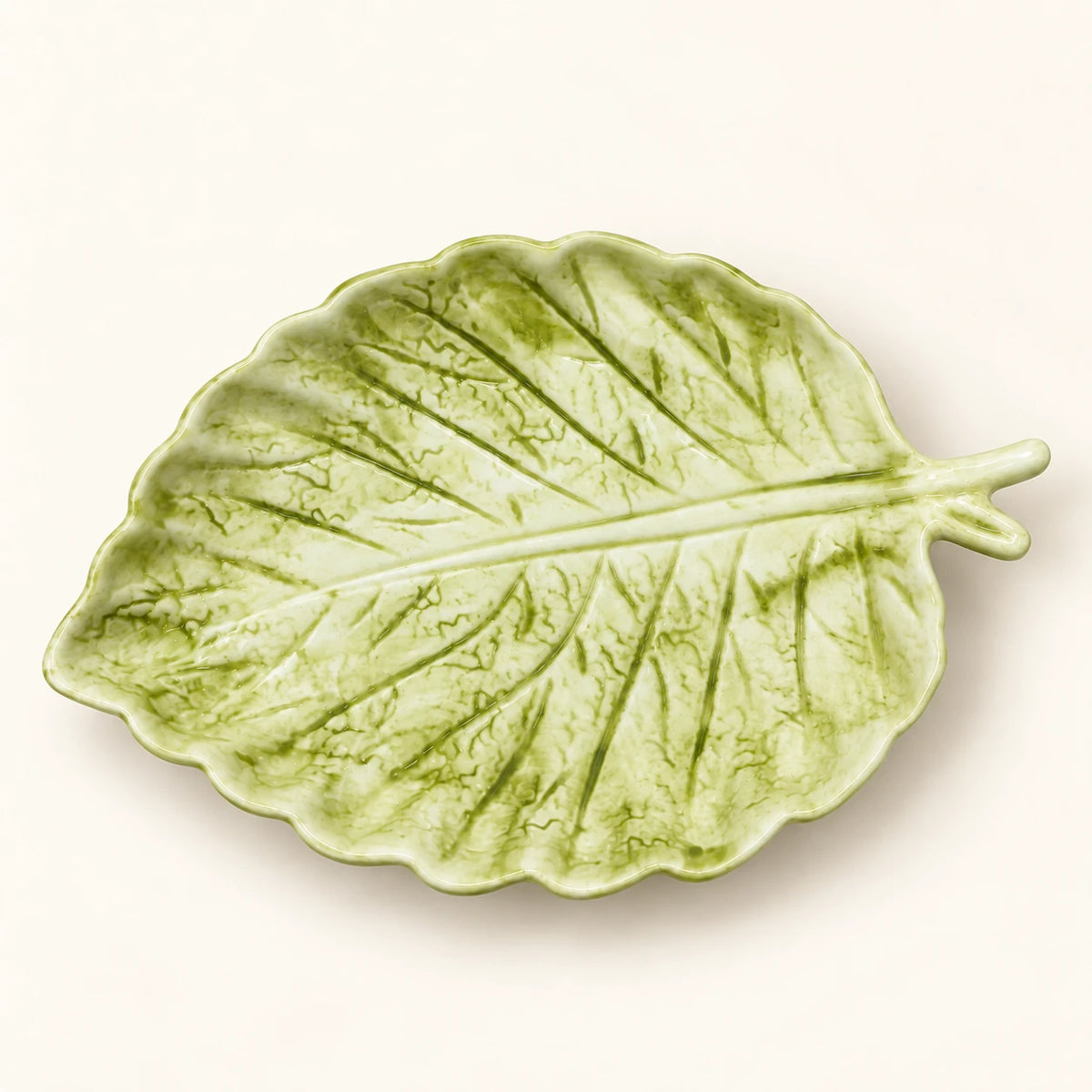 Overhead view of Berry Bloom green leaf plate with raised veins and shaded glaze