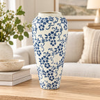 Tall blue floral ceramic decor vase styled on oak console, full product