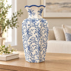 Blue floral scalloped rim ceramic vase styled on oak console, entire product visible