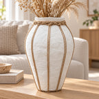 White papier-mache rope detail vase styled with dried stems on oak console