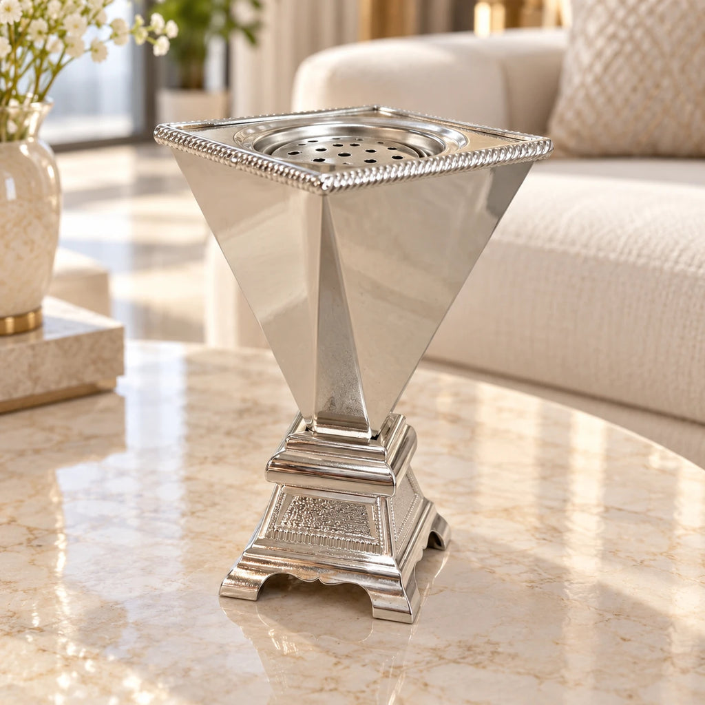 20 cm polished silver bakhoor incense burner with ornate pedestal on a marble side table