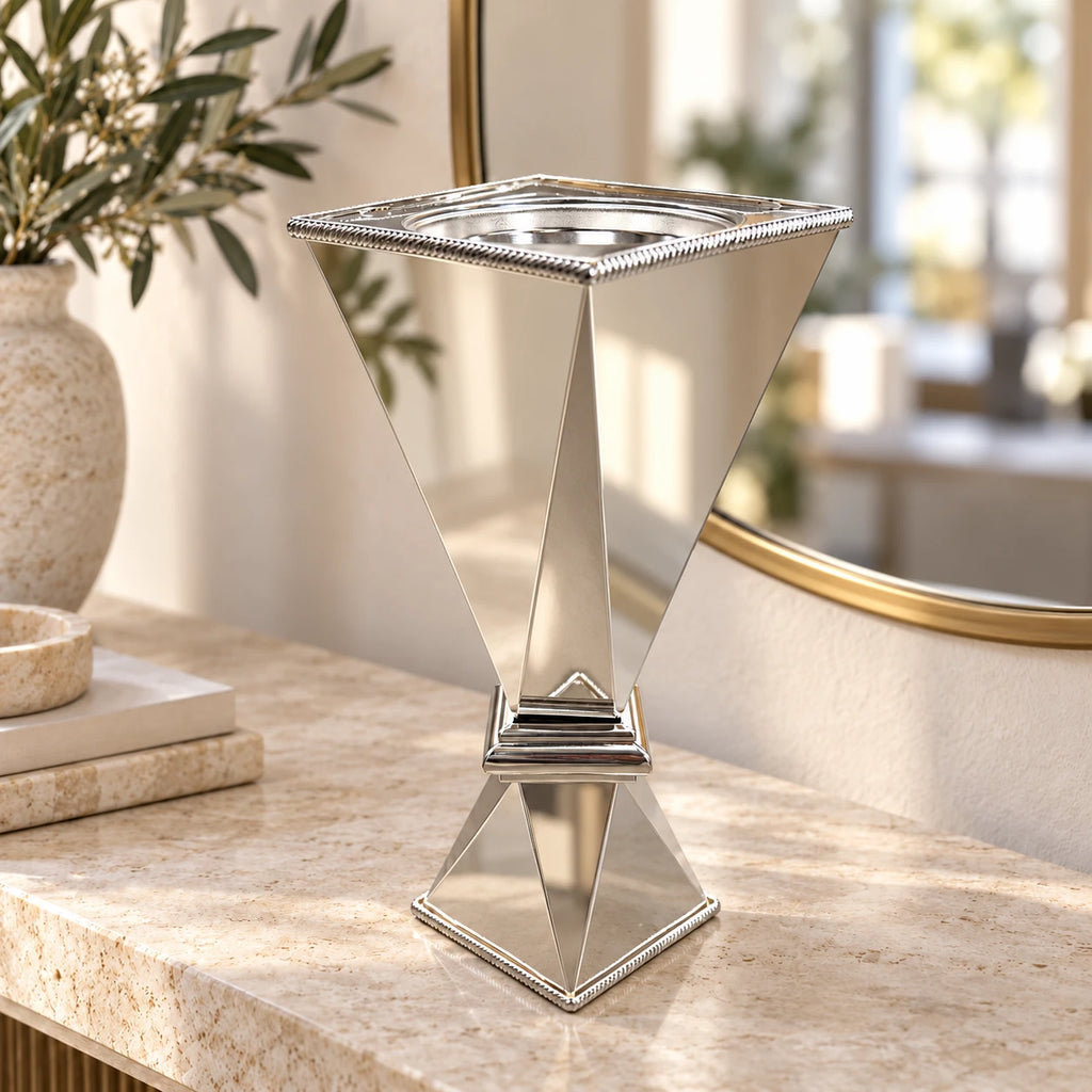 35 cm polished silver bakhoor incense burner on a light stone console beside a mirror