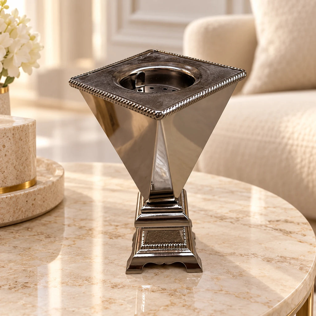 20 cm silver-tone bakhoor incense burner with ornate pedestal on a cream marble side table
