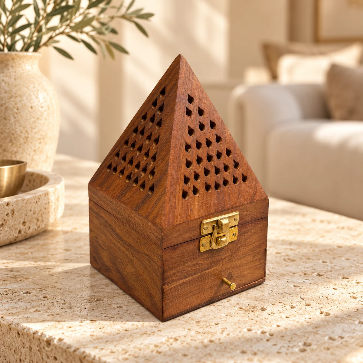 Wooden pyramid incense burner WLDJ-7128/M styled on a light stone console in a warm neutral living room